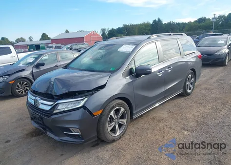 2020 Honda Odyssey Touring z USA, uszkodzony, nr VIN 5FNRL6H83LB033947